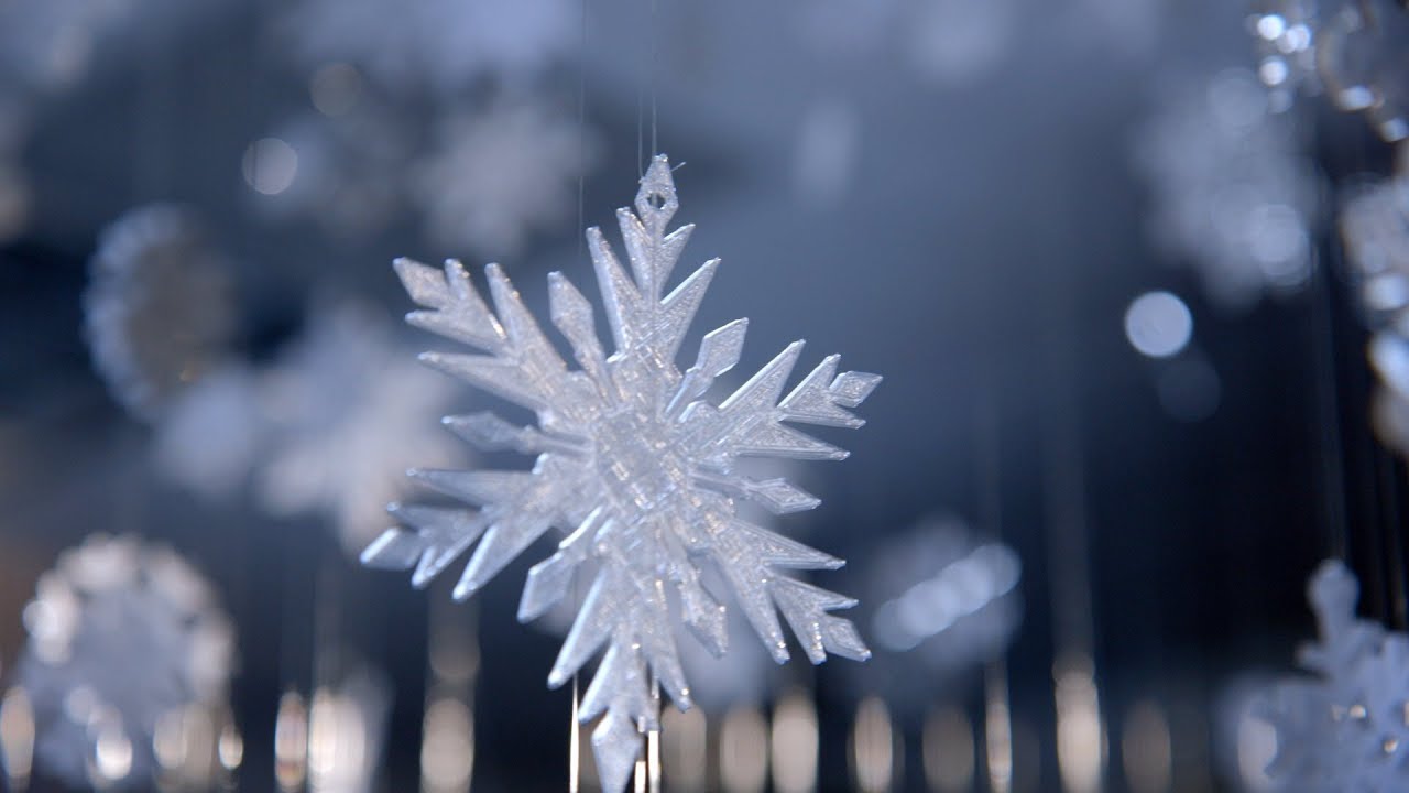 Screenshot from holiday video showing one of the snowflake decorations.